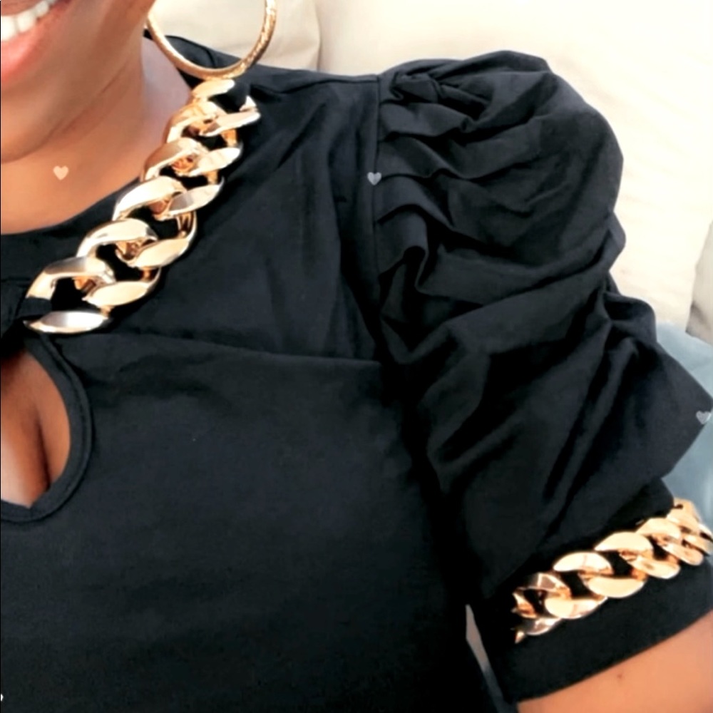 Black pullover top gold chain accent